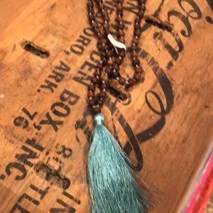 Wood beads with turquoise tassel